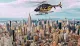 A yellow and black helicopter is flying over the New York City skyline featuring the Empire State Building.