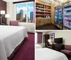 This image shows a tidy and modern hotel room with a large bed a desk with a chair a flat-screen TV and purple accents in the decor