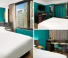 The image shows a modern bedroom with a large bed with teal walls colorful artwork and a view of an urban environment through the window
