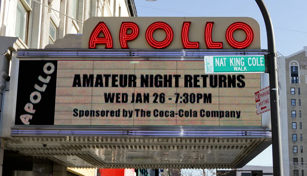 The image shows the iconic Apollo Theater marquee announcing the return of Amateur Night on January 26 at 730 PM sponsored by The Coca-Cola Company