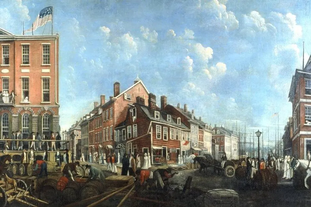 The image depicts a bustling colonial American street scene with people in period attire carts barrels and a building flying an early American flag