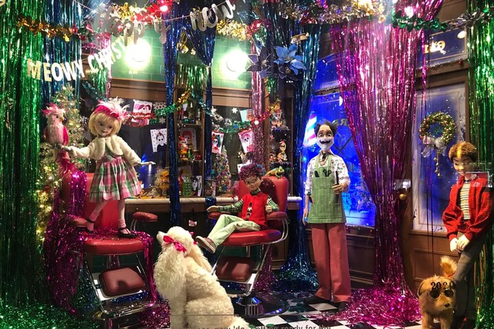 The image features a vibrant and colorful holiday-themed display with mannequins and animals in a festive and somewhat whimsical setting that includes a Meowy Christmas sign
