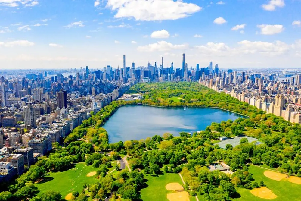 An aerial view of Central Park in New York City with the citys iconic skyline in the background