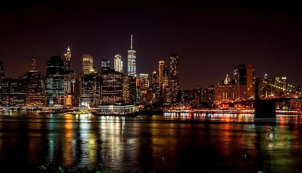 The image showcases a stunning nighttime skyline of a bustling city with illuminated skyscrapers reflecting in the water