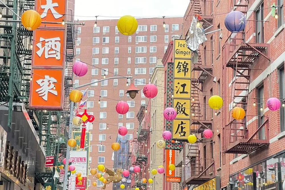 The image showcases a vibrant street scene adorned with colorful lanterns and Chinese signage possibly in a Chinatown district