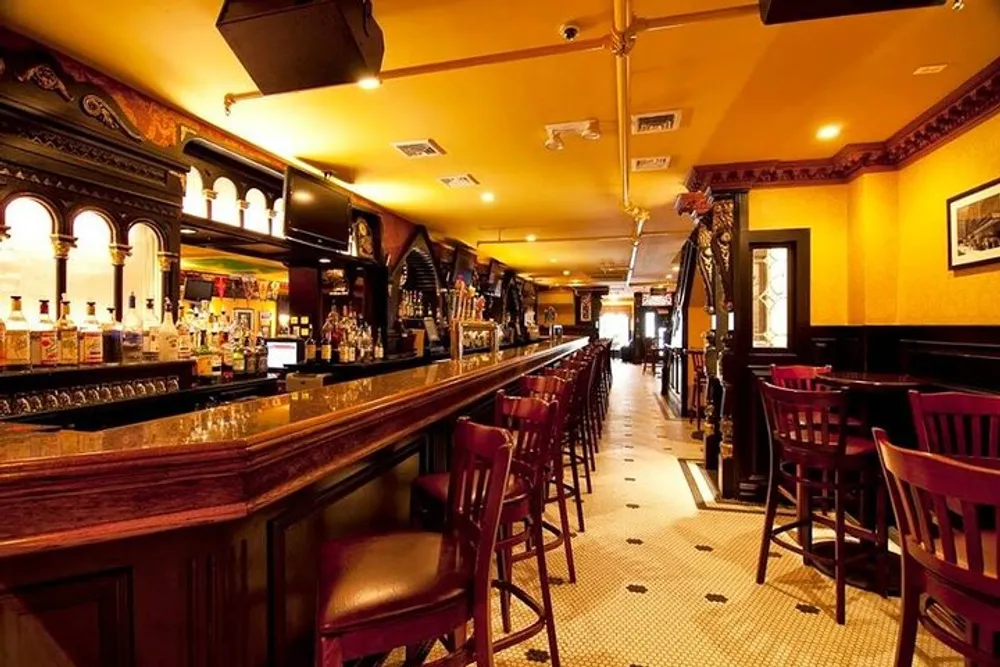 The image shows a traditional pub interior with a long wooden bar bar stools and a warm color palette