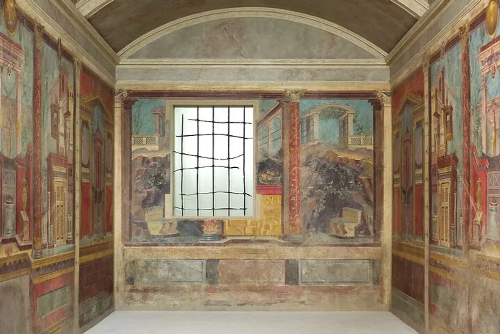 An ornately frescoed ancient Roman room with a large window revealing a bright exterior view