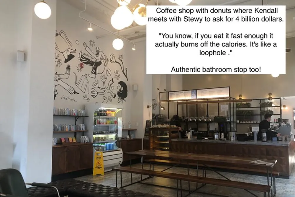 The image shows the interior of a coffee shop with a simple modern decor and a whimsical wall art accompanied by text overlays indicating a reference to a popular TV show scene and highlighting the authenticity of the location