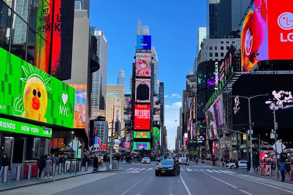 The image captures a vibrant street view of Times Square in New York City with large electronic billboards and urban activity