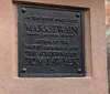 The image displays a commemorative plaque indicating that Mark Twain author of The Adventures of Tom Sawyer once lived in this house