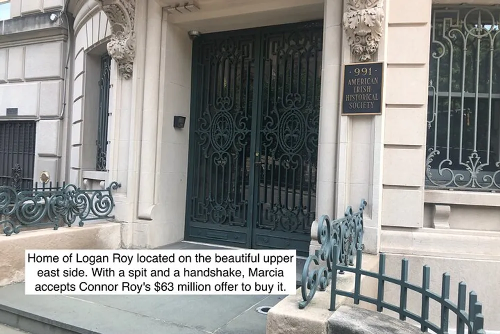 The image displays the exterior of an elegant building with ornate metalwork on the doors and a sign next to the entry that reads American Irish Historical Society accompanied by overlay text referencing a fictional event about Logan Roys home on the Upper East Side