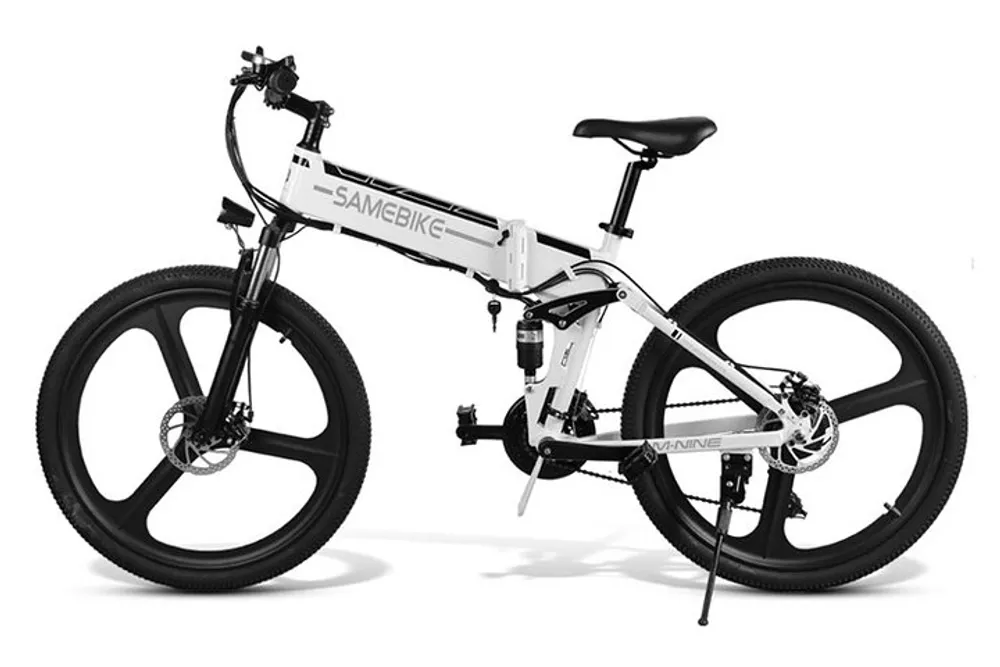 The image shows a modern white folding electric bicycle with thick black tires and a visible battery pack set against a plain white background