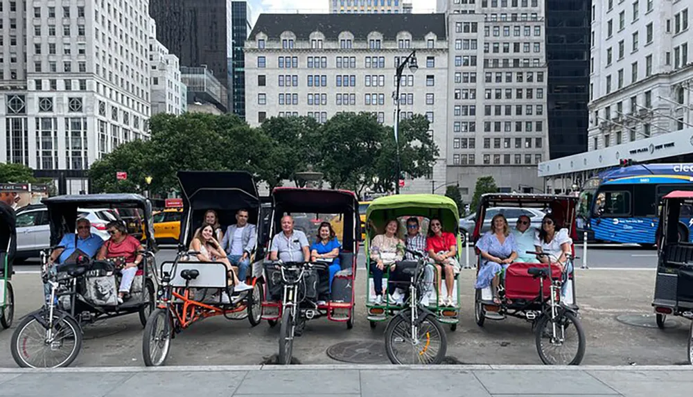 A row of pedicabs with passengers is lined up on a city street providing sightseeing tours in an urban environment