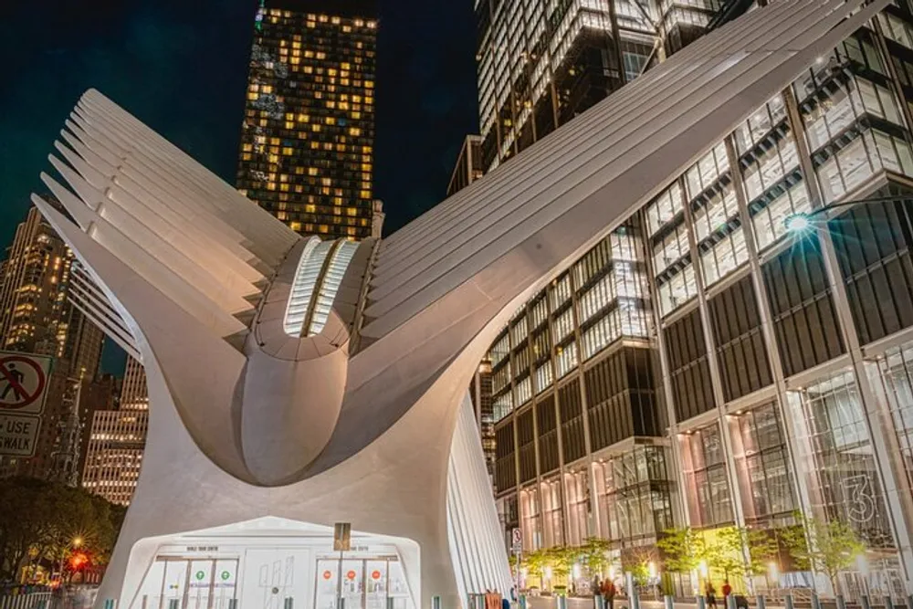 The image captures the distinctive architecture of the Oculus a modern transportation hub and shopping center in New York City at night