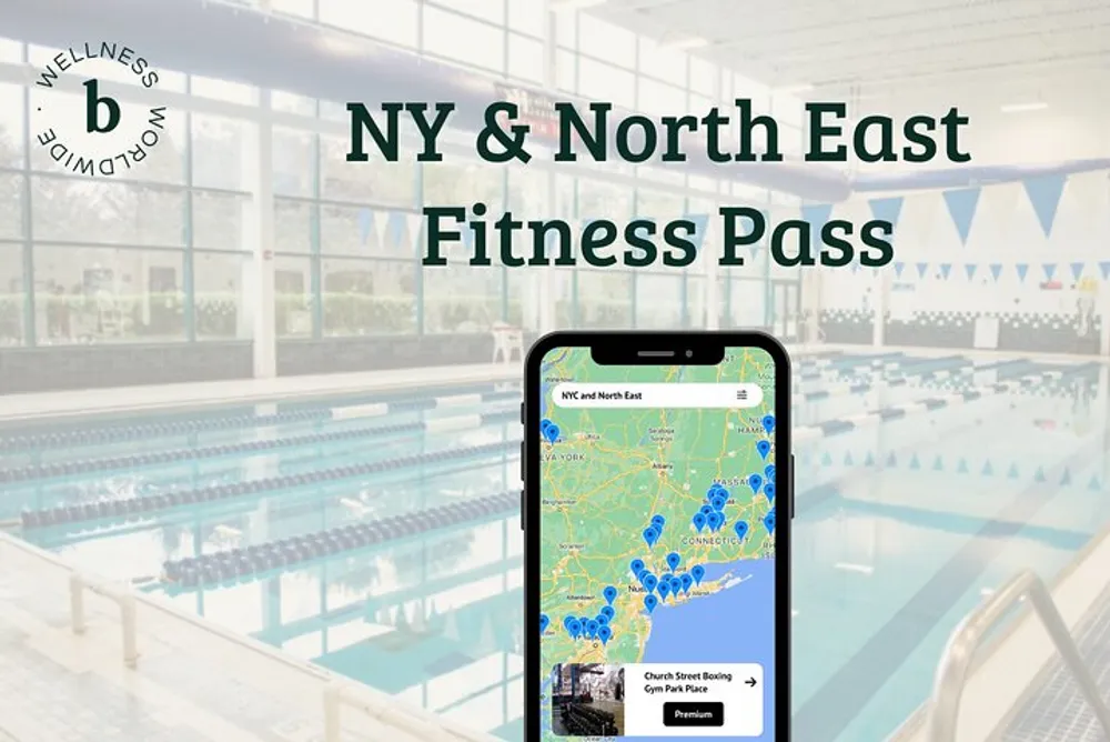 The image features an advertisement for a NY  North East Fitness Pass with a smartphone showing a map full of location markers on its screen placed against the blurred background of an indoor swimming pool