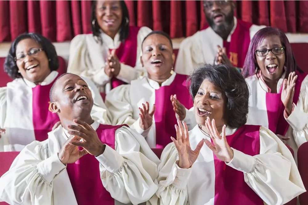 A joyful choir wearing white and red robes is singing and clapping with expressive and happy faces