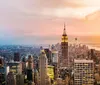 A smartphone is displaying a QR code for The New York Sightseeing Pass against the backdrop of a city skyline at twilight