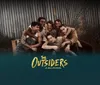 The image depicts a promotional poster featuring six young men embracing and smiling in front of a corrugated metal background with text at the bottom indicating The Outsiders A New Musical