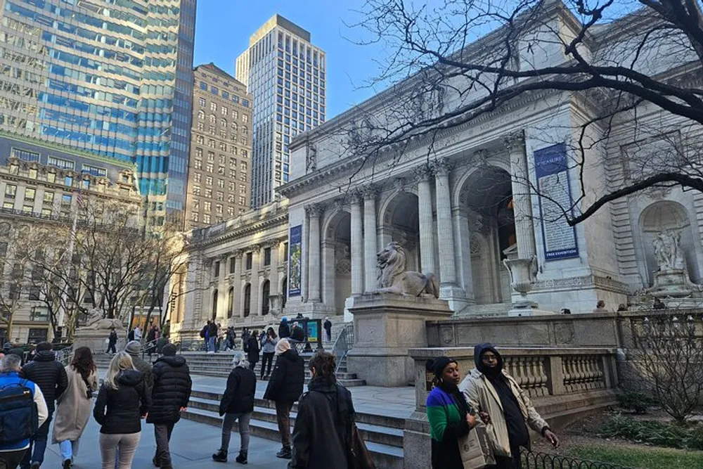 The image shows people walking near a grand building with columns and a stone lion sculpture set against a backdrop of urban skyscrapers and trees creating a blend of cultural architecture and bustling city life