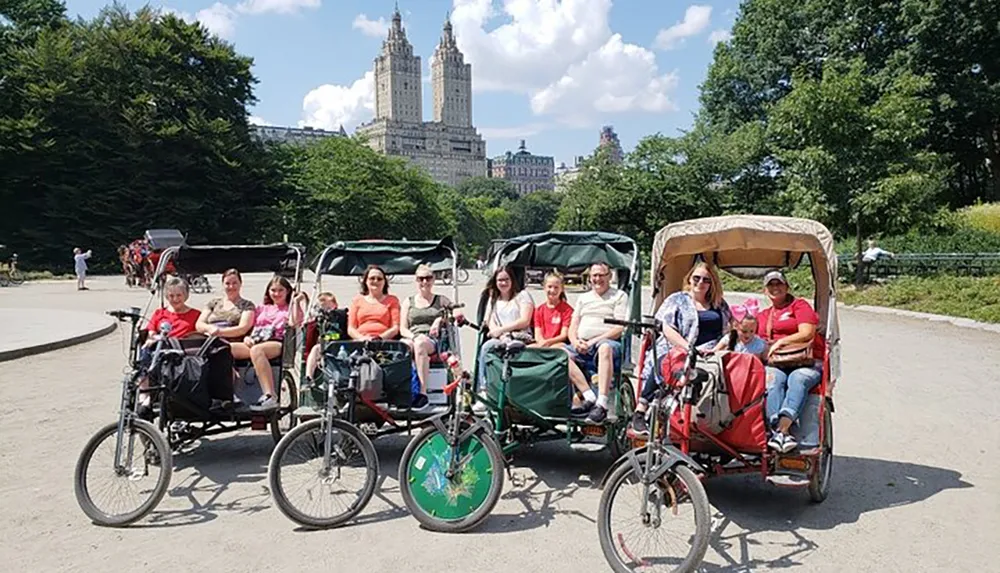 A group of smiling people enjoys a sunny day on a pedicab tour with a view of a tall historic building in the background