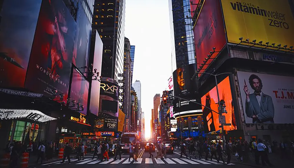 The image captures a bustling Times Square at twilight with illuminated advertisements towering over pedestrians and traffic