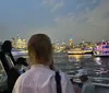 A ferry named Seaport Princess is docked near a pier with the Manhattan Bridge and the New York City skyline in the background