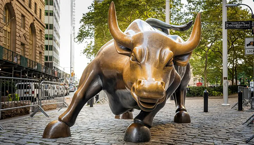 The image shows the Charging Bull statue a famous bronze sculpture located in the Financial District of Manhattan New York City symbolizing Wall Street and the Financial Market