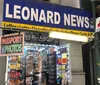 This image shows the storefront of Leonard News Inc advertising various products and services including coffee lotto cigarettes soda phone cards and passport photos