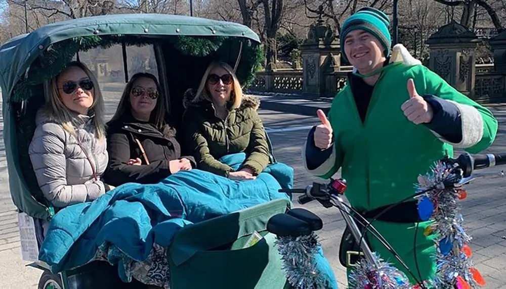 Three passengers are enjoying a festive pedicab ride with a driver dressed in a holiday-themed outfit giving a thumbs-up gesture