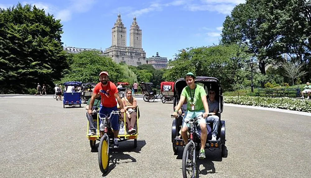 This image shows two pedicabs with passengers enjoying a sunny day in a park with lush greenery and tall buildings in the background