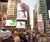 A couple is excitedly taking a selfie on a sightseeing bus in the bustling atmosphere of Times Square