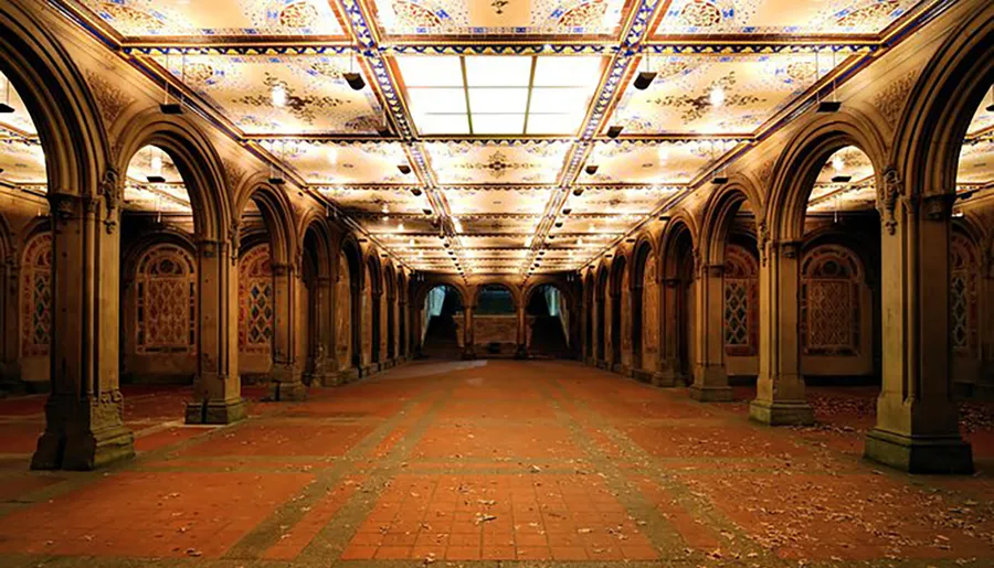 The image shows an ornate indoor arcade with arched openings, decorative patterns, and a brightly lit ceiling, creating an ambiance of historical elegance.