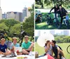 A family of six is enjoying a picnic in a park with bicycles in the background exuding a relaxed and happy atmosphere