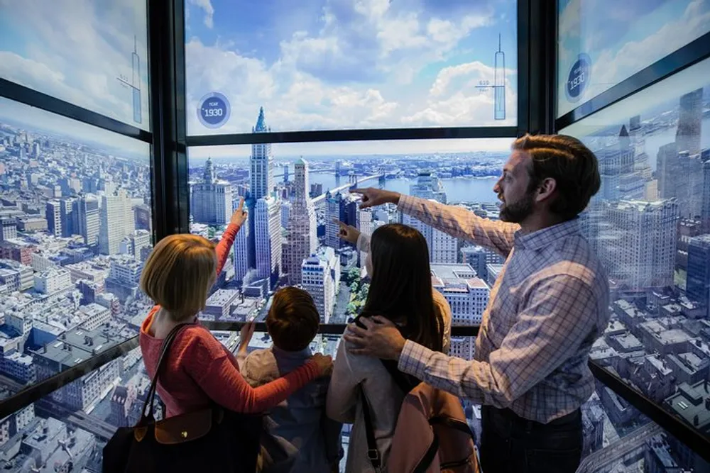 A family is engaging with an interactive display or window overlooking an urban skyline with the man pointing out something of interest to the group