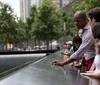 Visitors are seen reflecting and paying respects at the 911 Memorial in New York City