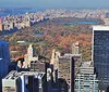 Visitors are enjoying a birds-eye view of a dense urban cityscape from an elevated observation deck